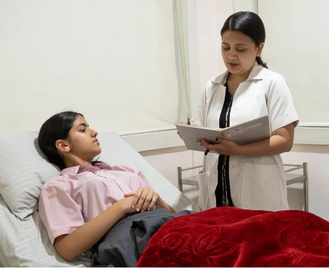 A student receiving care and support in the school infirmary, highlighting Manav Rachna International School’s safe and nurturing environment.